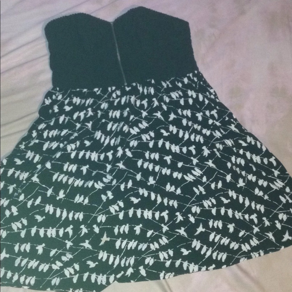 A black and white strapless dress with birds